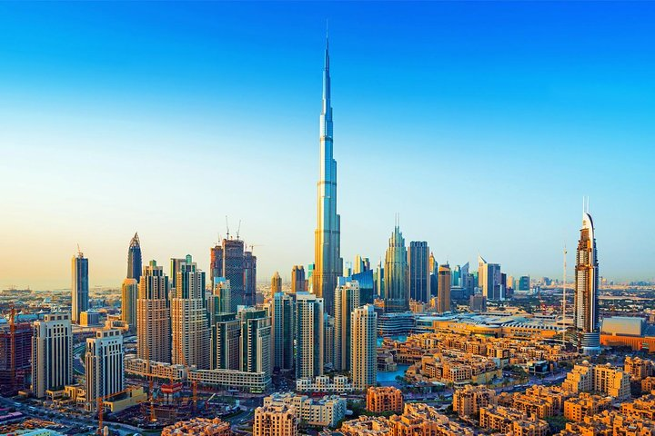 Experience the stunning skyline of Dubai highlighted by the iconic Burj Khalifa while enjoying adventurous desert thrills and rich cultural activities. Perfect for an unforgettable journey!